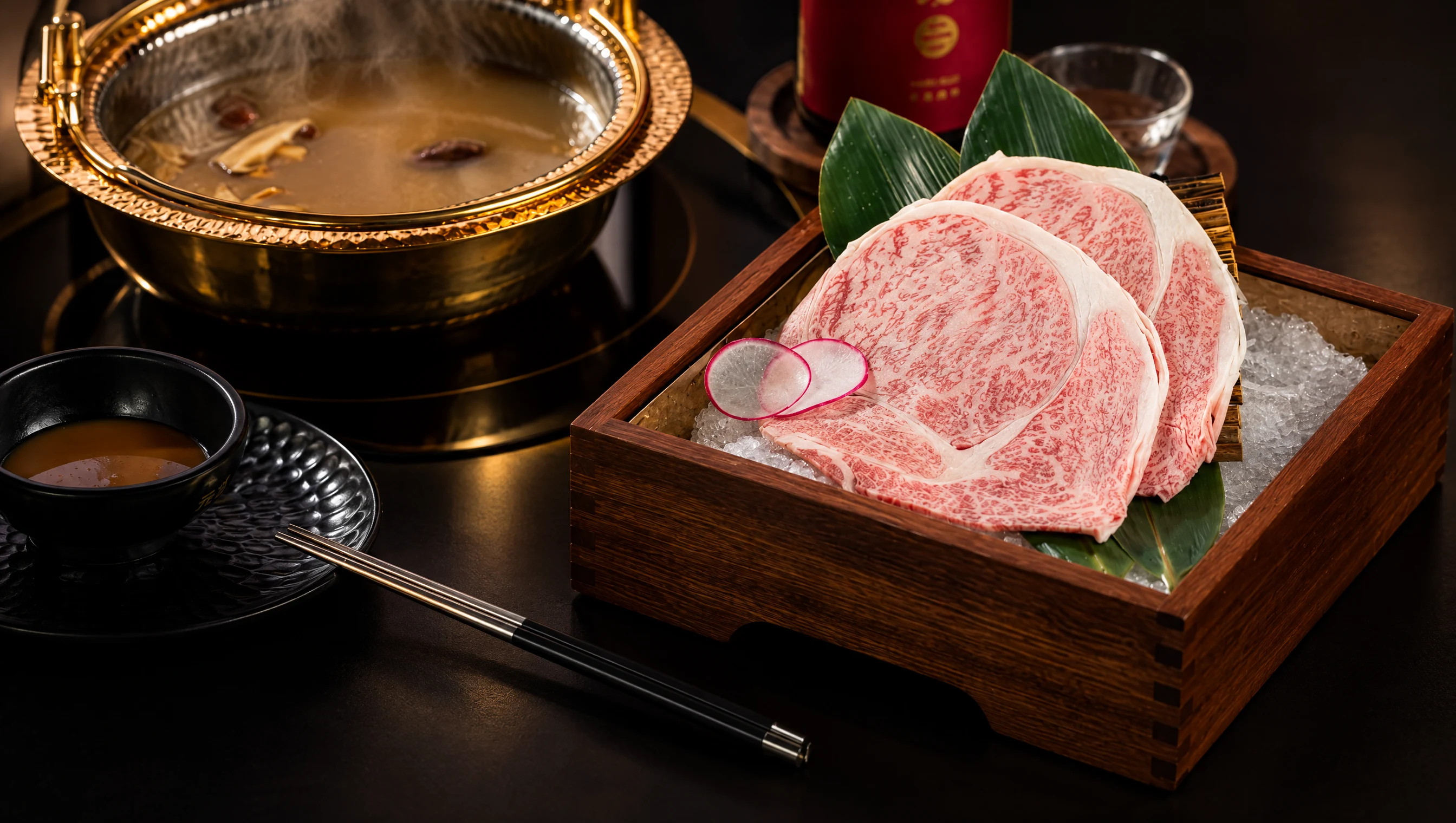 Marbled Wagyu slices on ice beside a brass shabu-shabu pot at Genki Wagyu House in Rockville, MD