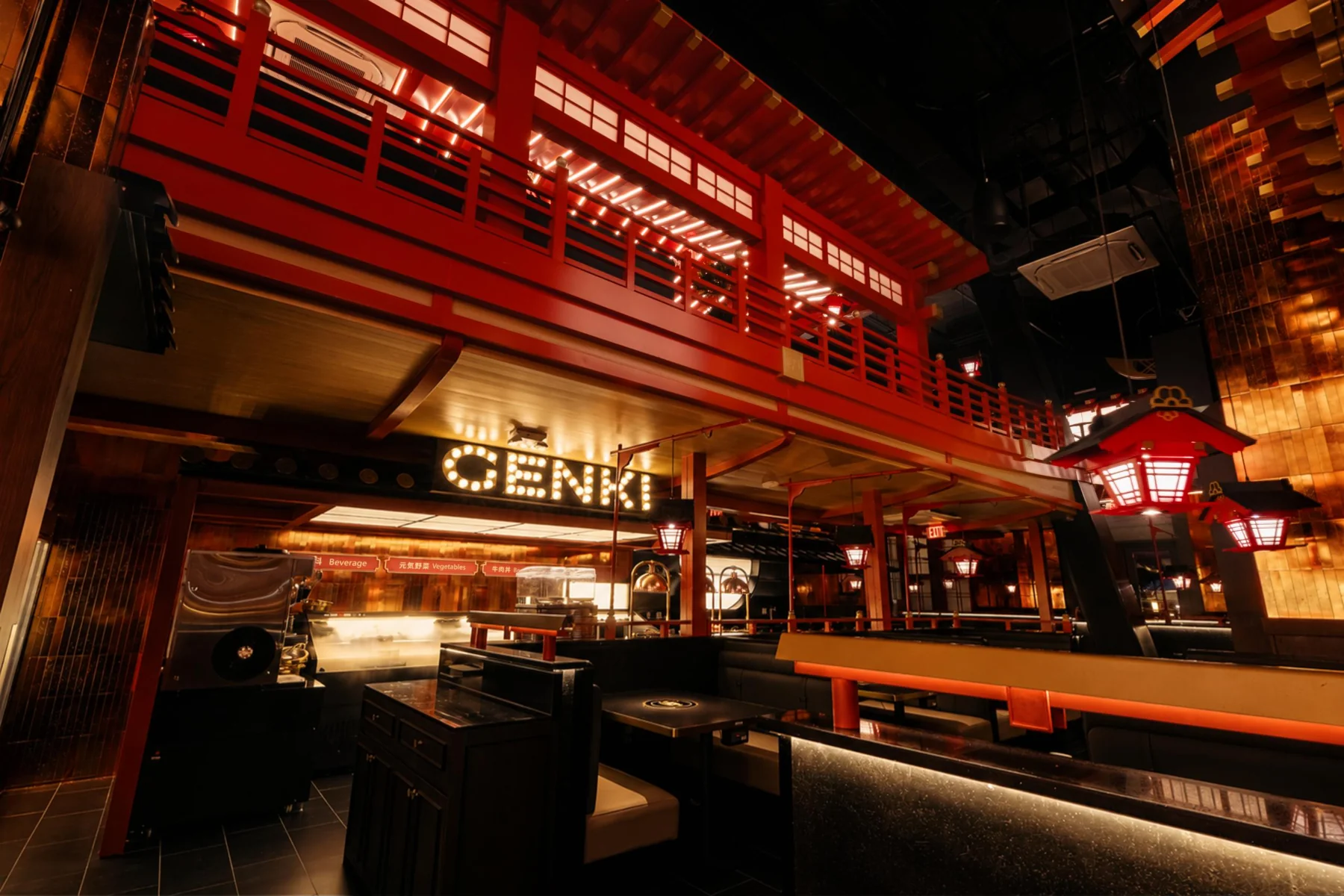 Genki Wagyu House's red and timber dining room under hanging lanterns