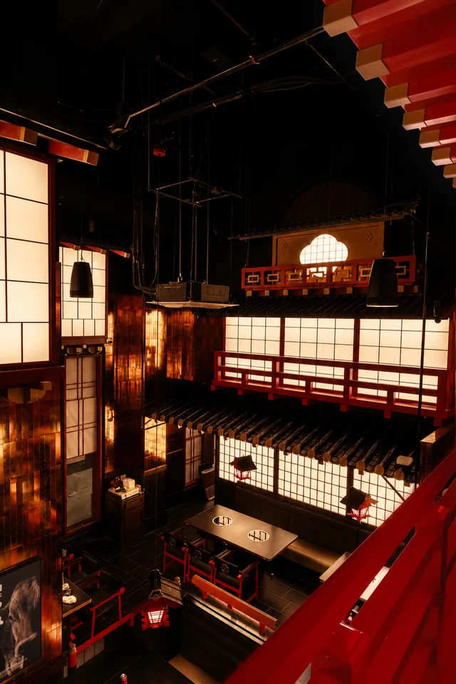 An upper-level view across Genki’s lantern-lit dining room